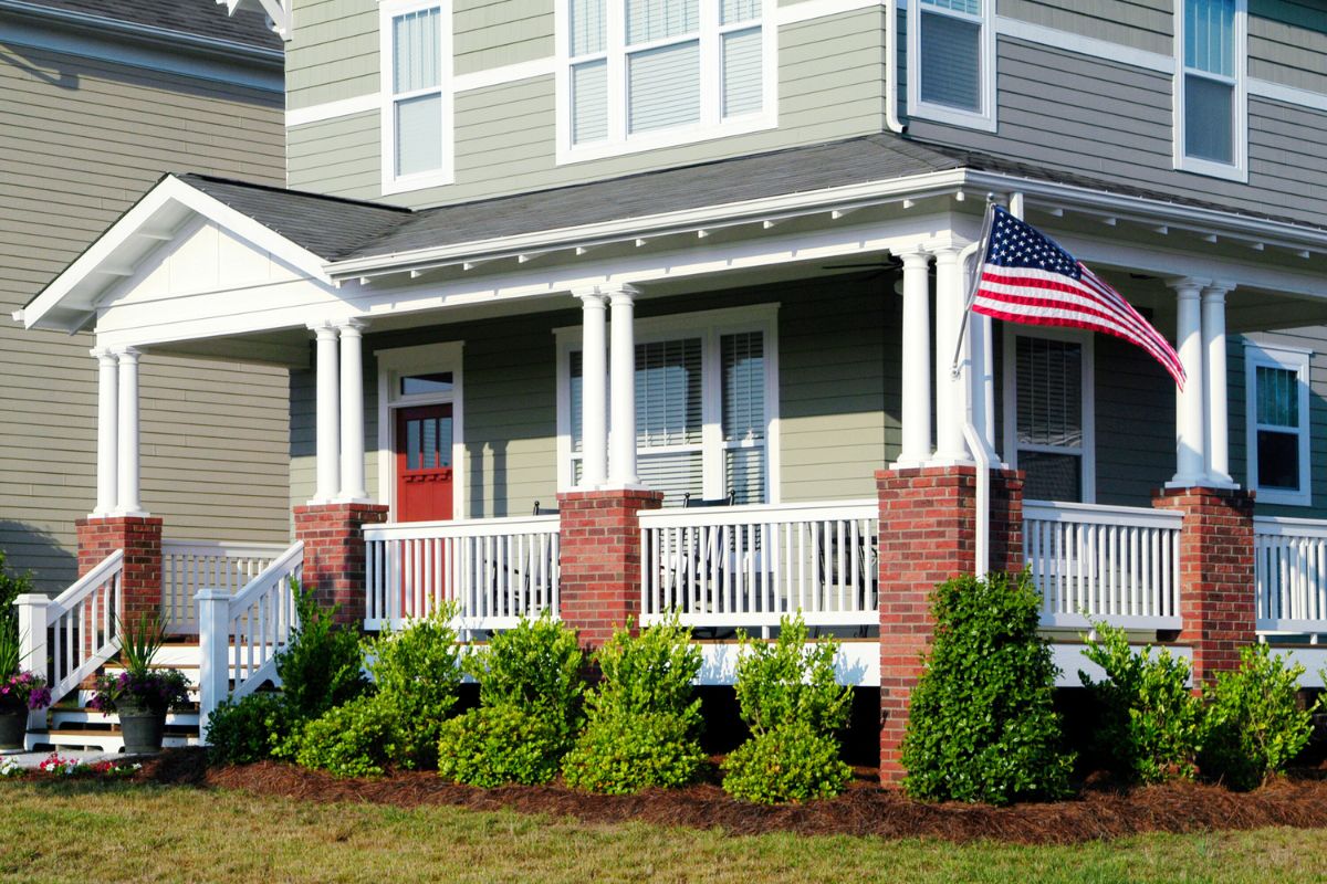 front porch with an american flag