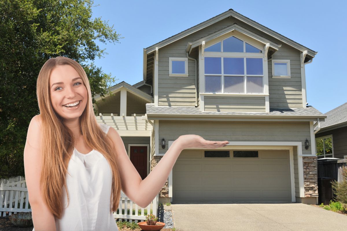 woman showing two story single family house with driveway