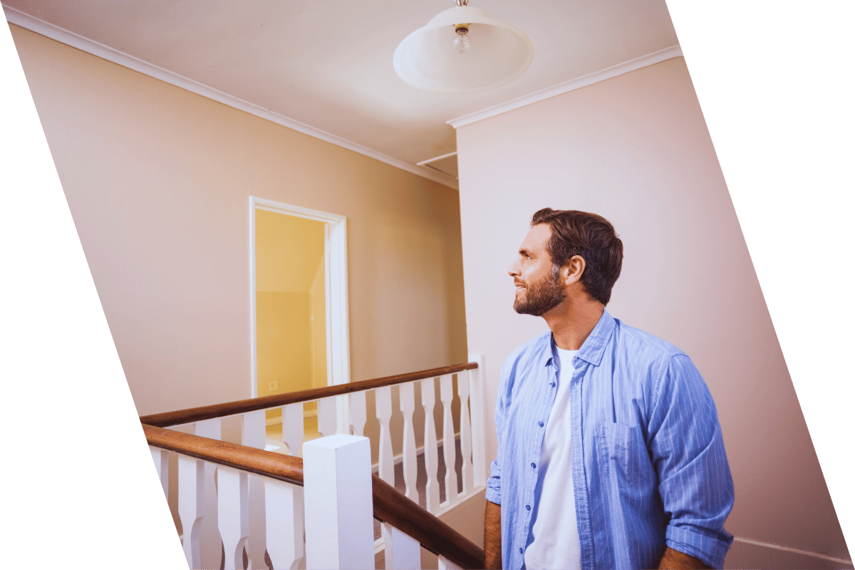 man happy to have a second story addition